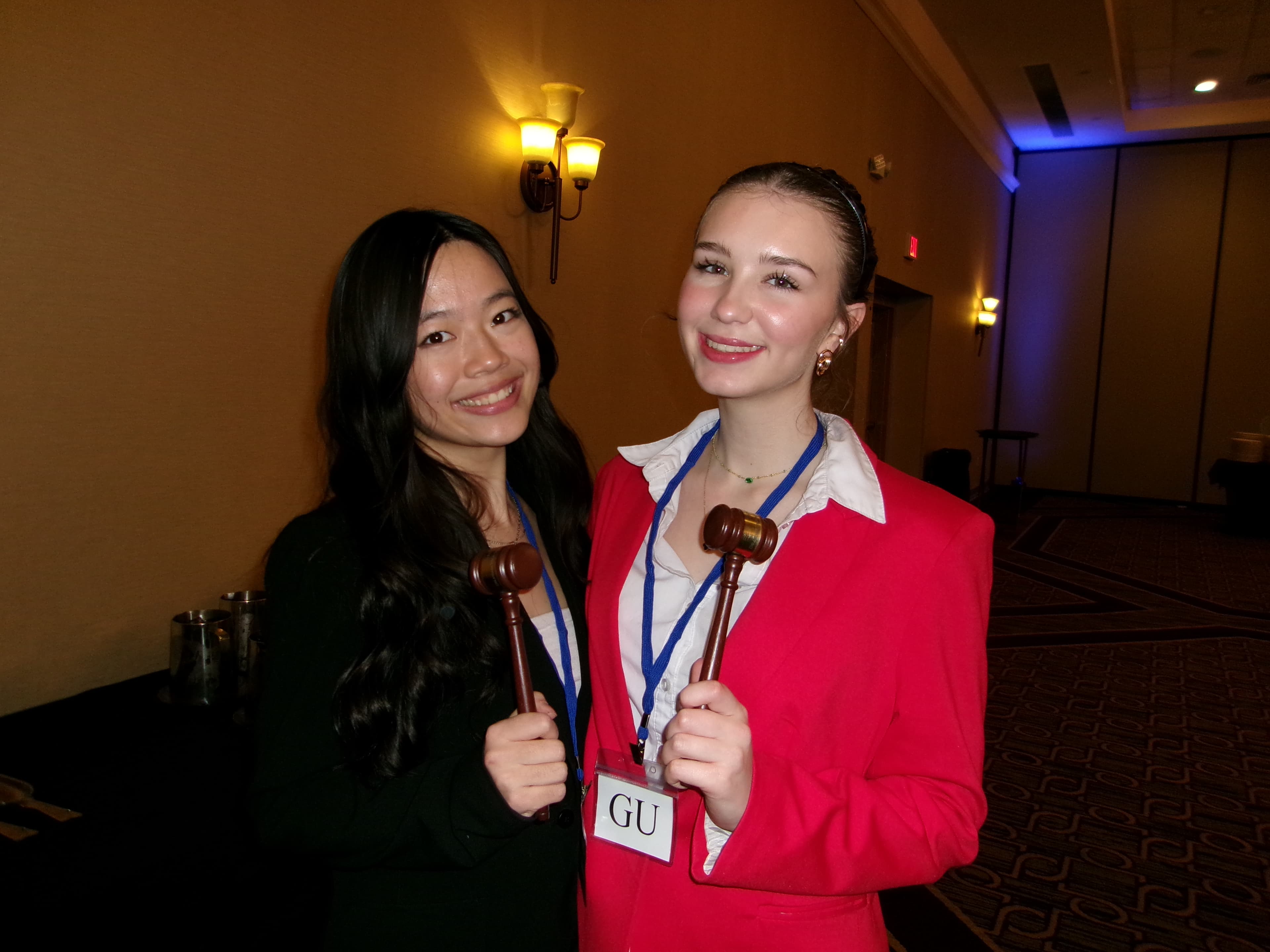 Doris and a friend holding gavels at a conference
